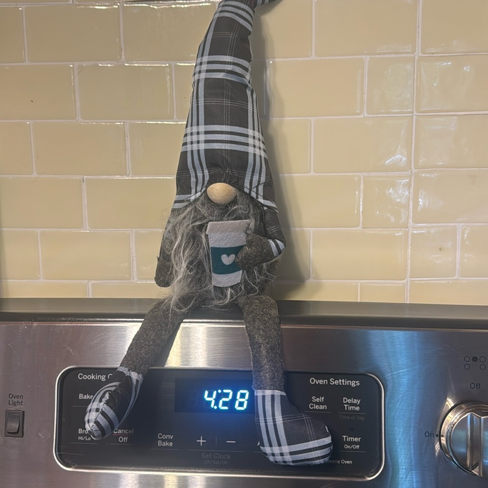 Gnome holding coffee cup